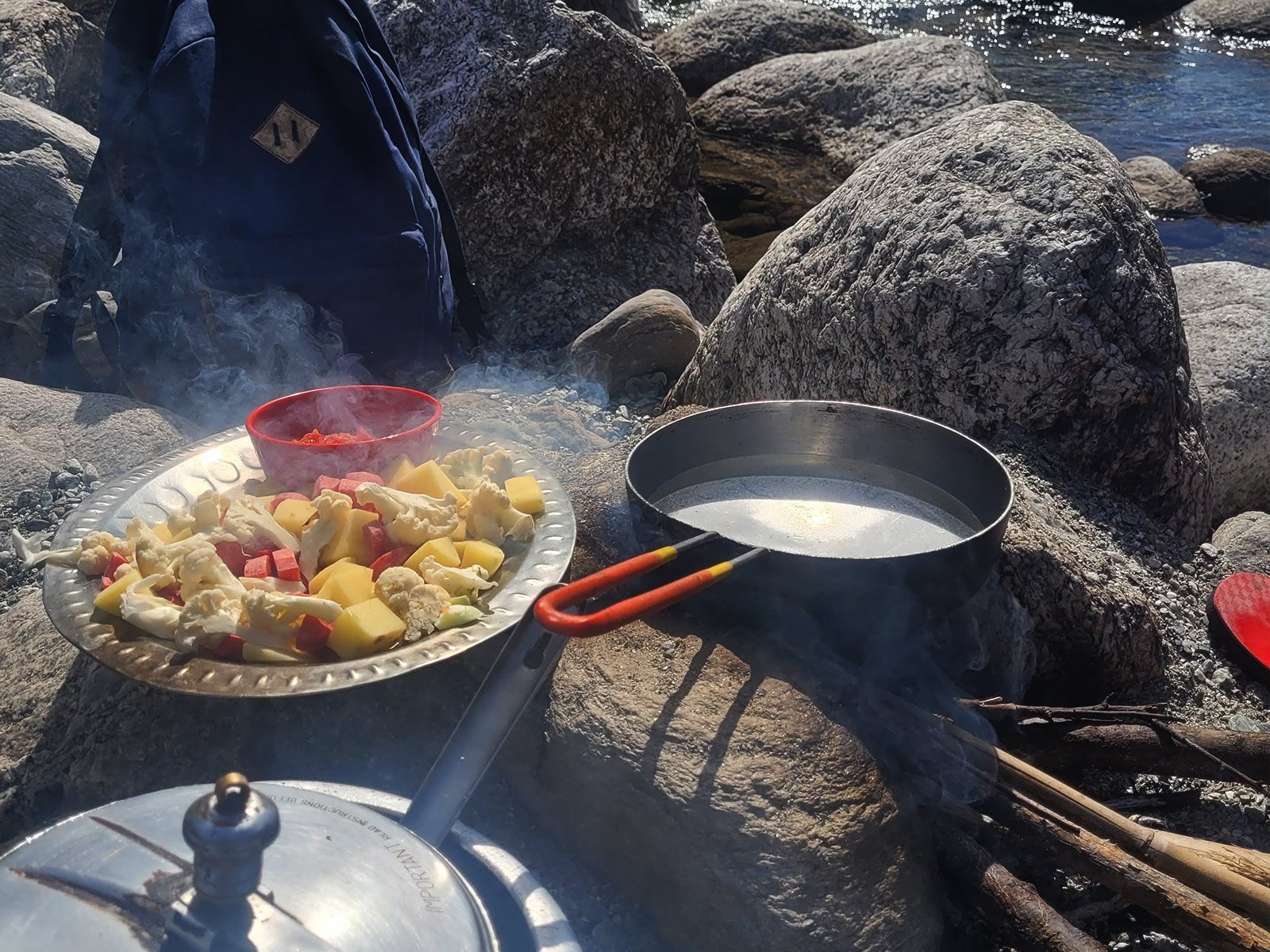 Outdoor cookout and riverside relaxation by Awa Khud stream